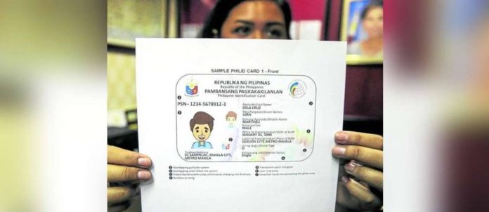 A congressional worker shows a sample of the PhilSys ID presented to the House of Representatives. INQUIRER FILE PHOTO