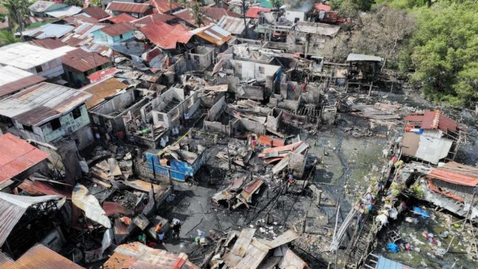 Aerial view of the aftermath of an early morning fire that displaced over a hundred residents of Sitio Dacutan Dacu, Barangay Mambulac in Silay City, Negros Occidental yesterday, Sept. 14. MAYOR JOEDITH C. GALLEGO PHOTO