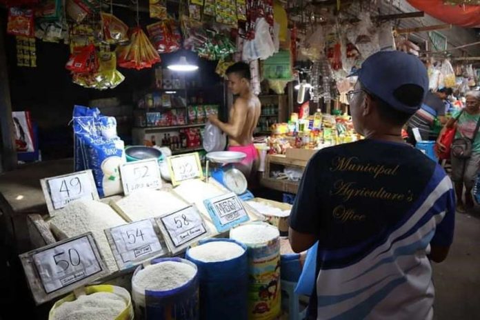 Personnel of the Municipal Agriculture Office and Business Permits and Licensing Office of Numancia, Aklan inspect rice prices at the Numancia Public Market on Sept. 6. NUMANCIA LGU PHOTO