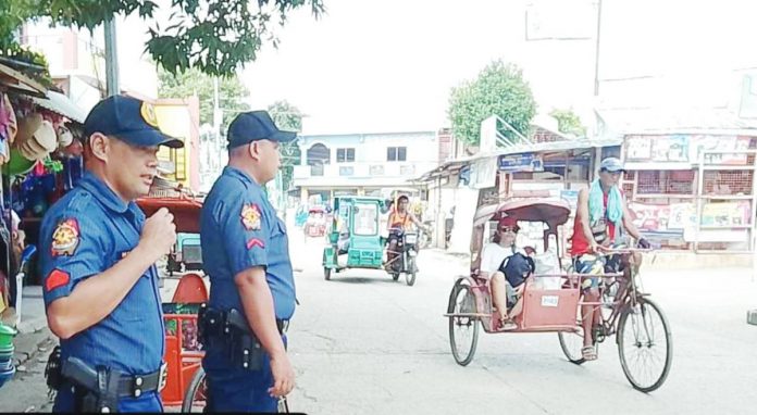 Police officers were stationed at the Calatrava Public Market in Barangay Suba, Calatrava, Negros Occidental. CALATRAVA PNP PHOTO