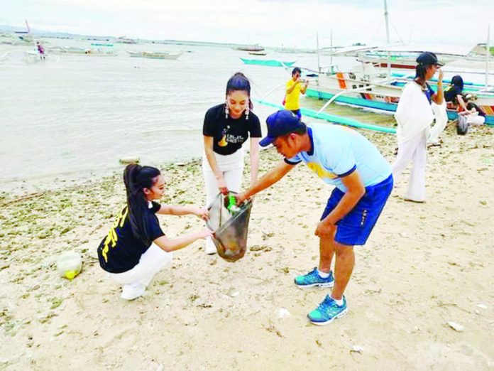 Lin-ay sang Iloilo 2023 candidates collect rubbish in Gigantes Island, Carles, Iloilo during a coastal cleanup activity on Sept. 23. LIN-AY SANG ILOILO FB PHOTO