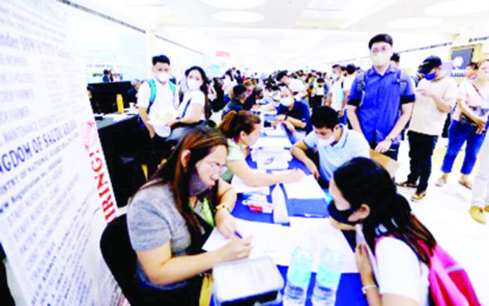 Employers interview applicants during the Labor Day job fair in Marikina City. The Maharlika Investment Fund can generate a 0.07-percentage point economic growth annually in the first 10 years of operation and generate about 100,000 direct and indirect jobs, the Department of Finance said Friday, Sept. 8. PNA PHOTO BY JOEY O. RAZON