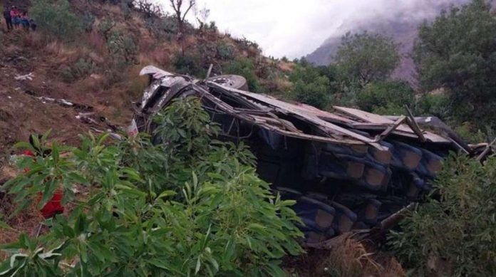 A handout photo made available by Agencia Andina shows the wreckage of a bus that fell into a ravine in Huaccoto, Churcampa province, Peru. The coach plunged some 200 meters from a mountain road. EPA