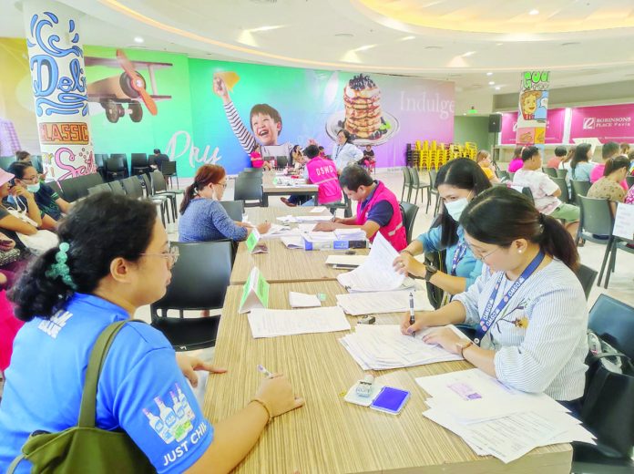 Personnel of the Department of Social Welfare and Development 6 conduct profiling of beneficiaries from the second and third districts of Iloilo province who will avail of the P15,000 cash assistance on Sept. 28. PIA ILOILO