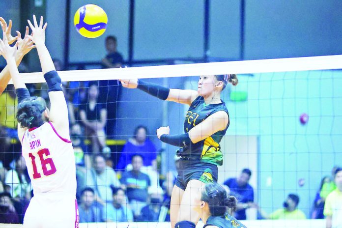 Negrense Kiesha Bedonia of Far Eastern University Lady Tamaraws drills a powerful hit against a University of Perpetual Help Lady Altas defender. PHOTO COURTESY OF V-LEAGUE