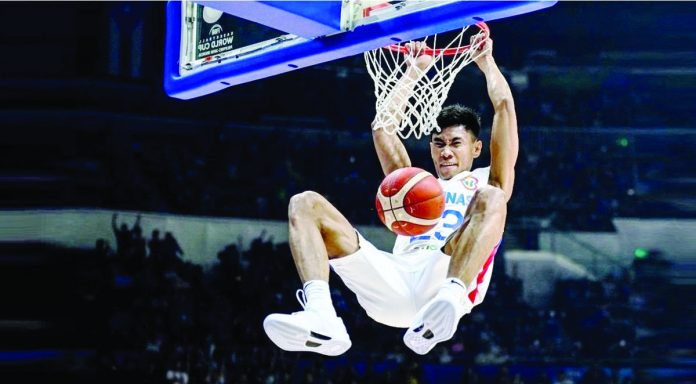 Gilas Pilipinas’ Rhenz Abando hangs in the ring for a two-handed dunk during their 96-75 win over China in the 2023 FIBA Basketball World Cup on Saturday night. FIBA PHOTO