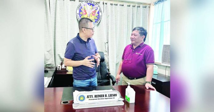 MORE Electric and Power Corporation president and chief executive officer Roel Castro (right) personally visited Iloilo City Election Officer Atty. Reinier Layson to ensure that the company is ready and prepared for the barangay and Sangguniang Kabataan elections.