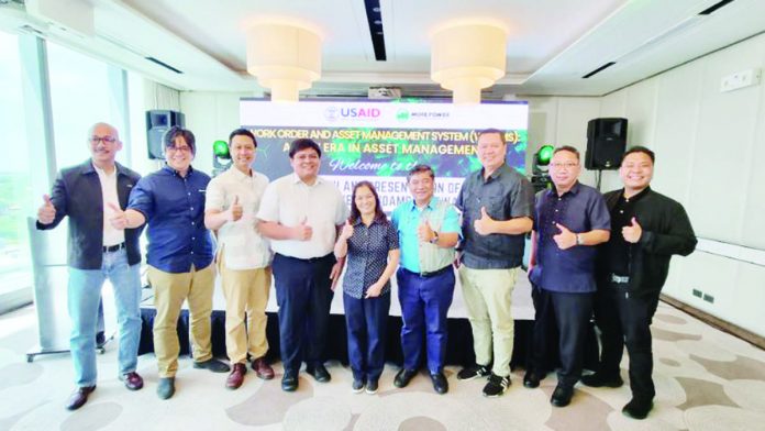 MORE Electric and Power Corporation president and chief executive officer Roel Z. Castro (4th from right) leads the launching of the power firm’s Work Order and Asset Management System. With him are (from left) Engr. Bernard Bailey Del Castillo, MORE Power’s Vice President for Network Development and Operations Group; Emil Diez, Iloilo Business Club president; Jay Treñas, Executive Assistant to Iloilo City’s Mayor Jerry Treñas; Lyan B. Villacorta, Regional Energy and Climate Change Specialist, United States Agency for International Development; Mongolia Divina B. Chingcuanco, USAID-ESP; Iloilo Provincial Board member Rolando Distura; Cesar Emmanuelle Buyco, Jr.; and Rey Victor Garin.