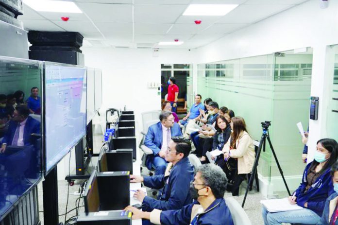 Philippine Charity Sweepstakes Office (PCSO) officials witness the launch of the Philippine Lottery System at the PCSO Conservatory Building in Mandaluyong City on Oct. 1. PCSO PHOTO