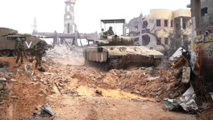 An Israeli tank moves through Gaza Strip, in footage supplied by the Israeli military. IDF PHOTO