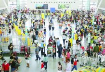 People fall in line at the check-in counters of the Ninoy Aquino International Airport (NAIA) Terminal 3 in Pasay City. The Manila International Airport Authority expects around 1.2 million passengers at the NAIA during the Barangay and Sangguniang Kabataan Elections and Undas break. GEORGE CALVELO/ABS-CBN NEWS PHOTO