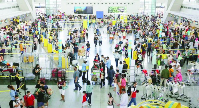 People fall in line at the check-in counters of the Ninoy Aquino International Airport (NAIA) Terminal 3 in Pasay City. The Manila International Airport Authority expects around 1.2 million passengers at the NAIA during the Barangay and Sangguniang Kabataan Elections and Undas break. GEORGE CALVELO/ABS-CBN NEWS PHOTO