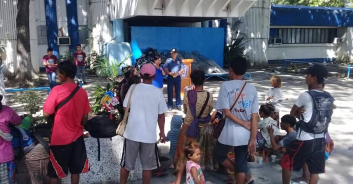 The Badjao adults and children at the Bacolod City police headquarters after they were rounded up from the streets. BACOLOD CITY POLICE OFFICE FILE PHOTO