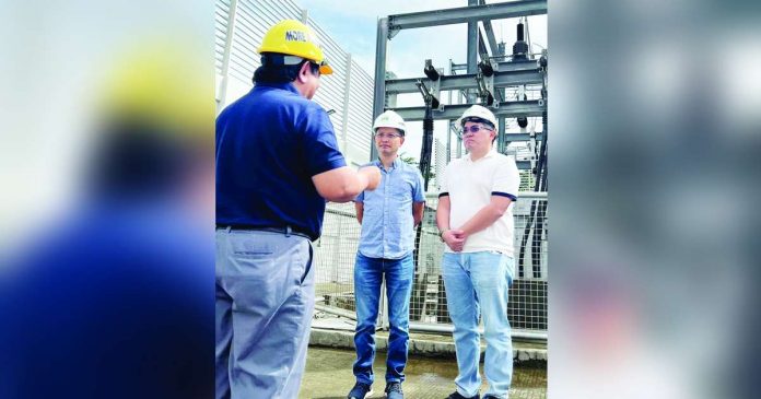 Cong. Mike Gorriceta (first from right) of Iloilo’s 2nd District and Cong. Kiko Benitez (center) of Negros Occidental’s 3rd District visit the facilities of MORE Electric and Power Corporation in Iloilo City to personally see the power distribution utility’s best practices. Gorriceta authored the franchise expansion bill for MORE Power to expand its service to Iloilo’s 2nd District. Benitez, on the other hand, is one of the authors of House Bill 9310 granting a franchise to Negros Electric and Power Corp to operate in Central Negros. Giving them a briefing is MORE Power’s president and chief executive officer Roel Z. Castro.