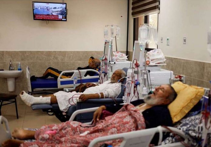 Palestinian kidney patients lie on hospital beds, as health officials say they are running out of fuel to operate dialysis devices, amid the ongoing Israeli-Palestinian conflict, at Naser hospital in Khan Younis in the southern Gaza Strip. REUTERS