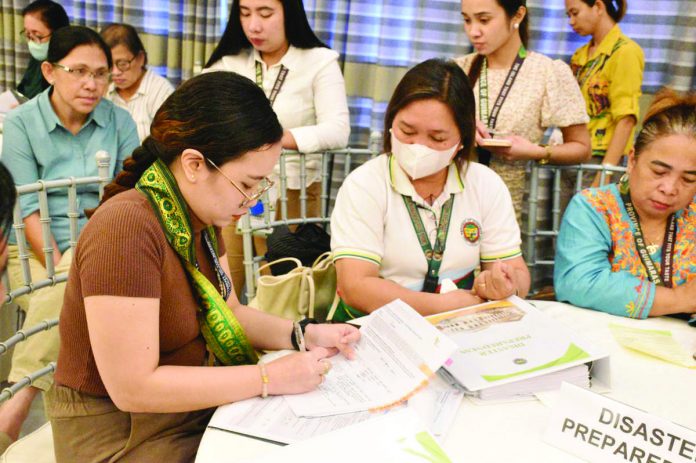 A team of national validators for the 2022 Seal of Good Local Governance review the disaster preparedness plans of Guimaras province during a visit last week. PROVINCE OF GUIMARAS PHOTO