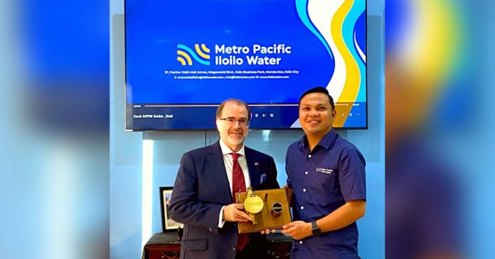 Canadian Ambassador David Bruce Hartman (left) visits Metro Pacific Iloilo Water in Iloilo City. Welcoming him is Robert Cabiles, the Chief Operations Officer of the water firm.