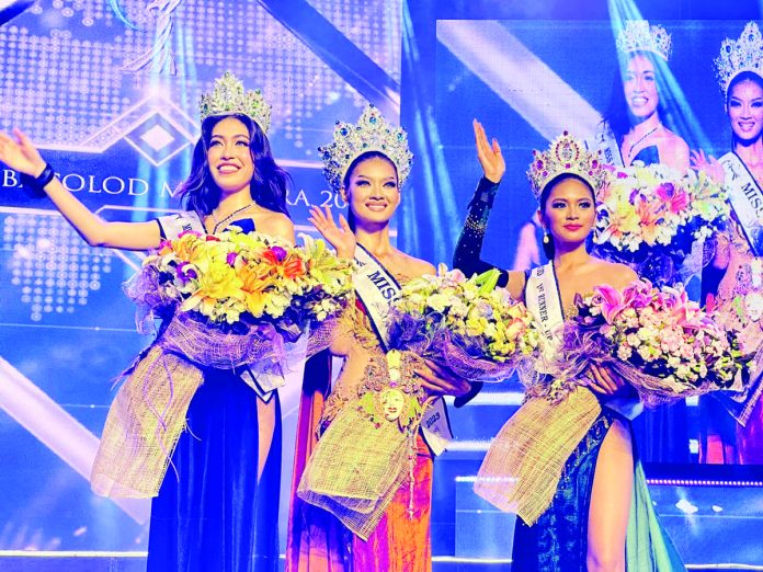 (From left) second runner-up Elli Rose Elola, Miss Bacolod MassKara 2023 Yvonne Catamco and first runner-up Tracy Mae Sunio . AKSYON RADYO BACOLOD PHOTO