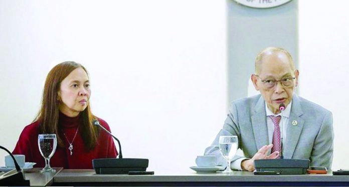 Bureau of Treasury officer-in-charge Sharon Almanza (left) and Finance secretary Benjamin Diokno (right) share at a briefing on Friday, Sept. 29, that demand for the latest retail onshore dollar bonds exceeded the USD200 million initial offering. As of Sept. 27, the government has so far raised USD611 million from the RDB 2 offering. DOF PHOTO