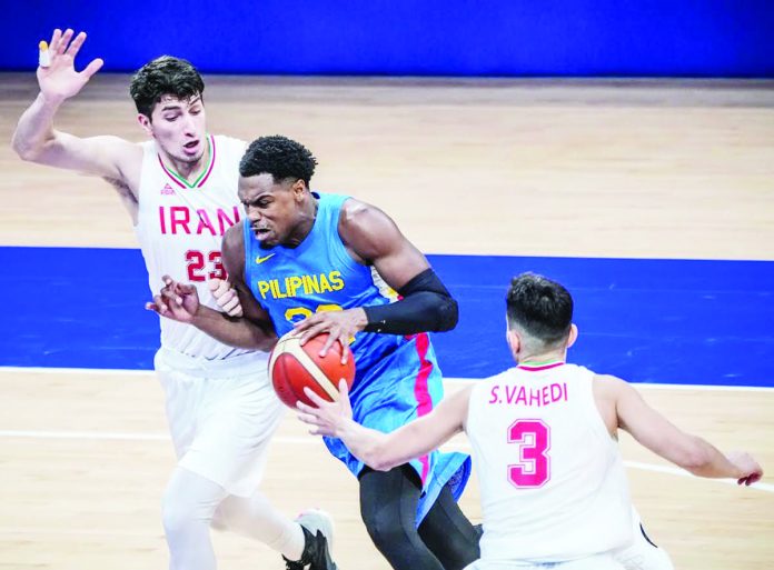 Justin Brownlee’s possible two-year suspension for failing a doping test would only be confirmed if his B-sample also tests positive for the prohibited carboxy-THC, which is associated with cannabis use. He is shown here tackling two Iranian players during the 19th Asian Games in China. PHOTO COURTESY OF POC-PSC MEDIA POOL