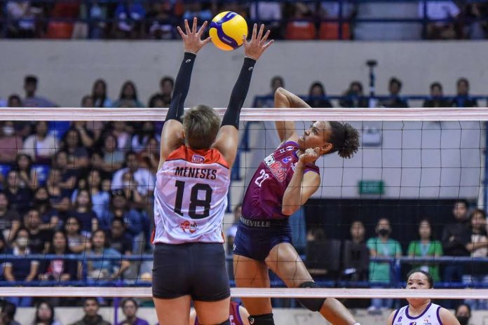 Choco Mucho Flying Titans’ Cherry Nunag aims to smash the ball against the defense of Cignal HD Spikers’ Marivic Meneses. PVL PHOTO