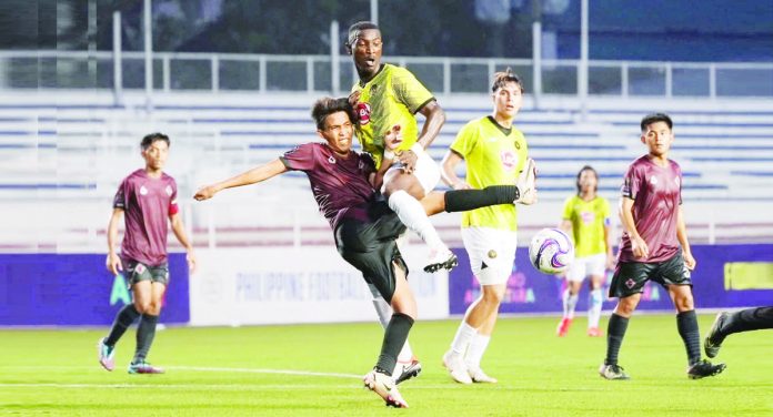 Kaya Futbol Club-Iloilo’s Abou Sy jumps into a University of the Philippines Fighting Maroons player during their 2023 Copa Paulino Alcantara quarterfinals match. PHOTO COURTESY OF KAYA-ILOILO