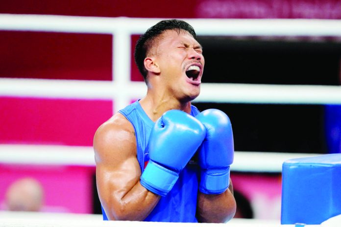 Filipino boxer Eumir Marcial reacts after bowing to China’s Tanglatihan Tuohetaerbieke in the19th Asian Games men’s 80-kilogram gold medal match last night at the Hangzhou Gymnasium in China. PHOTO COURTESY OF AIJAZ RAHI/AP