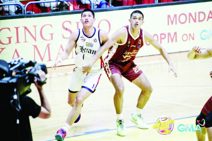 University of Perpetual Help Altas’ Angelo Gelsano (25) battles Colegio de San Juan de Letran Knights’ Joseph Nunag for the rebound. PHOTO BY NCAA/GMA SPORTS