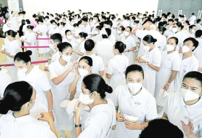 Nursing students wait for the capping and pinning ceremony. INQUIRER FILE PHOTO
