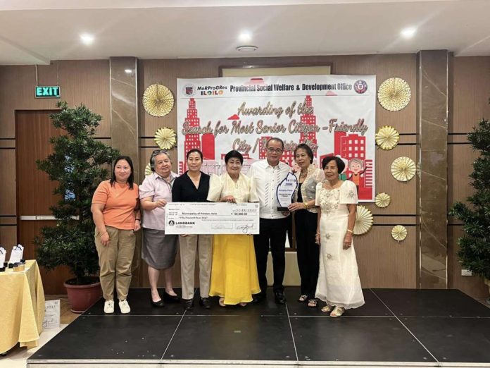 Provincial Administrator Dr. Raul Banias and Provincial Social Welfare and Development Office head Sarah M. Barayuga award the plaque of recognition and P50,000 cash prize to the municipality of Pototan as the Most Senior Citizen-Friendly Municipality in the province of Iloilo. PHOTO COURTESY OF DR. RAUL BANIAS