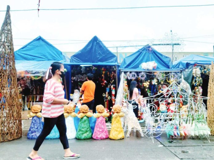 The Bureau of Fire Protection Region 6 advises the public to avoid purchasing low-quality and substandard Christmas lights, which significantly increase the risk of fires. Photo shows stalls selling Christmas decorations. CONTRIBUTED PHOTO