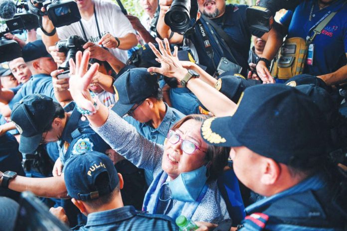 Former senator and human rights campaigner Leila de Lima waves as she leaves the Muntinlupa Regional Trial Court on Monday, Nov. 13, after being granted bail. The decision — celebrated by her supporters, colleagues, and human rights advocates — puts her a step closer to freedom after nearly seven years behind bars. "After six years, eight months and 24 days, sweet, sweet freedom. Thank you Lord," de Lima says. Philippine Daily Inquirer, Ted Aljibe/AFP