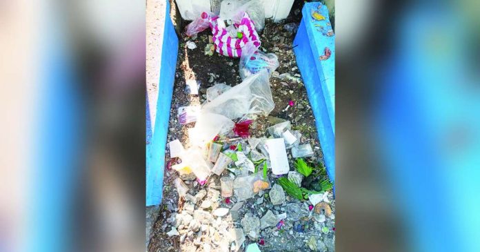 The Iloilo City Environment and Natural Resources Office says most of the garbage collected inside the cemeteries were food wrappers and packaging materials. Photo shows the trash left behind by Tanza Public Cemetery visitors. AJ MARCELO PALCULLO/PN