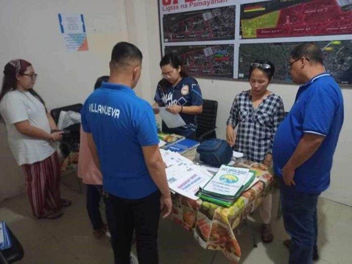 Department of Interior and Local Government District Officer of Arevalo, Iloilo City leads the ceremonial turnover of barangay properties, accountabilities and financial records to the new set of Barangay Calaparan officials on Nov. 8. DILG-ILOILO CITY PHOTO