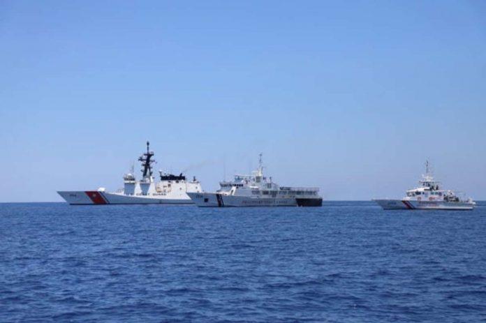 Philippine Coast Guard ships BRP Batangas and BRP Kalanggaman (center and right) sail with the USCGC Bertholf (left) on May 14, 2019, some 50 nautical miles from Subic Bay. PHOTO FROM THE PHILIPPINE COAST GUARD