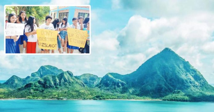 The Mt. Manaphag in Pan de Azucar Island in Concepcion, Iloilo is seen in this undated photo. Learners (inset) of Fernando A. Arlos Memorial School and Diogracias Arlos National High School in Barangay Tambaliza, located in Pan de Azucar Island, held placards on Thursday, Nov. 30, to show opposition to the mining exploration in Pan de Azucar Island. PHOTO COURTESY OF RODEL ALCALA VIA RMN ILOILO, DR. RAUL BANIAS PHOTO