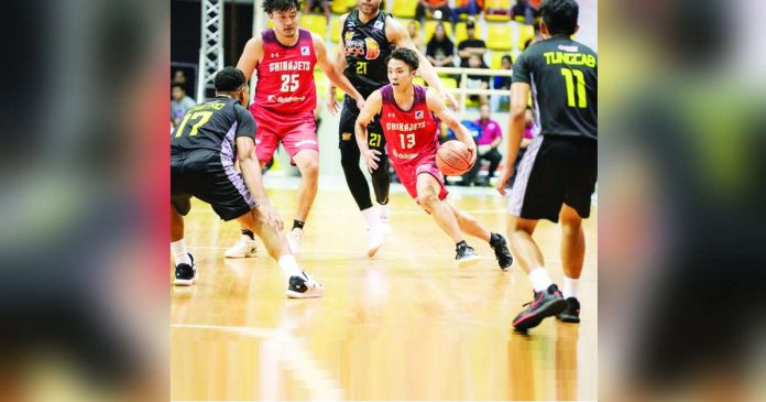 Chiba Jets’ Sota Okura (13) tries to dribble past the defense of TNT Tropang Giga’s Jayson Castro. PHOTO COURTESY OF EASL