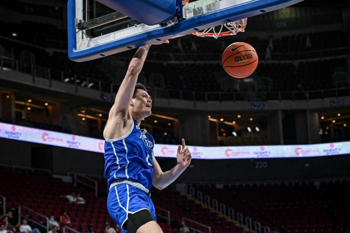 Ateneo de Manila University Blue Eagles' Kai Ballungay goes for a one-handed dunk. UAAP PHOTO