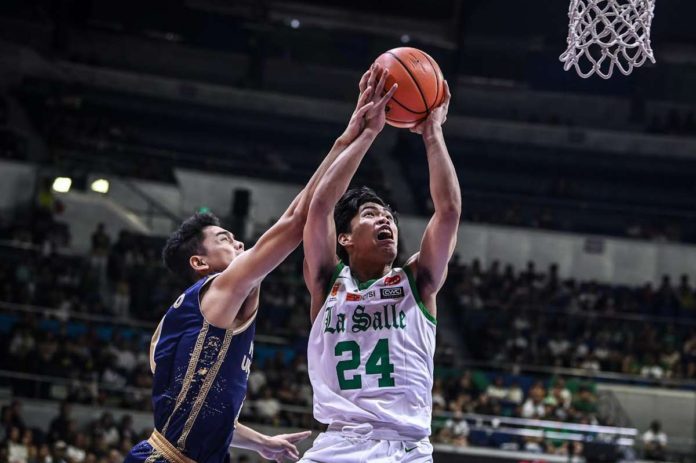 Negrense Mark Nonoy of De La Salle University Green Archers was fouled by a National University Bulldogs player as he goes for a basket. UAAP PHOTO