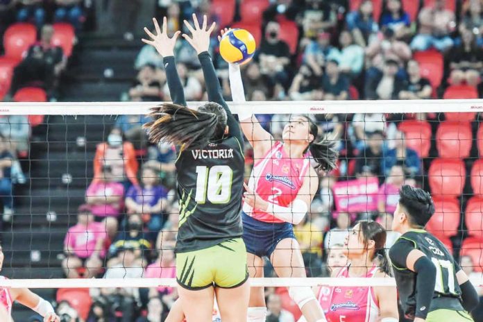 Creamline Cool Smashers’ Alyssa Valdez scores against the defense of Nxled Chameleons’ Camille Victoria. PVL PHOTO