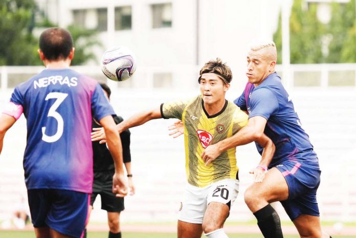 Kaya Futbol Club-Iloilo’s Daizo Horikoshi was held by a Stallion-Laguna FC player. PHOTO COURTESY OF KAYA-ILOILO