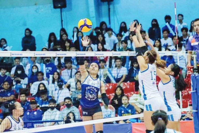 Negros ICC Blue Hawks’' Angel Mae Habacon scores against the defense of Bacoor City Strikers Metro Land Builders Corp. MPVA PHOTO