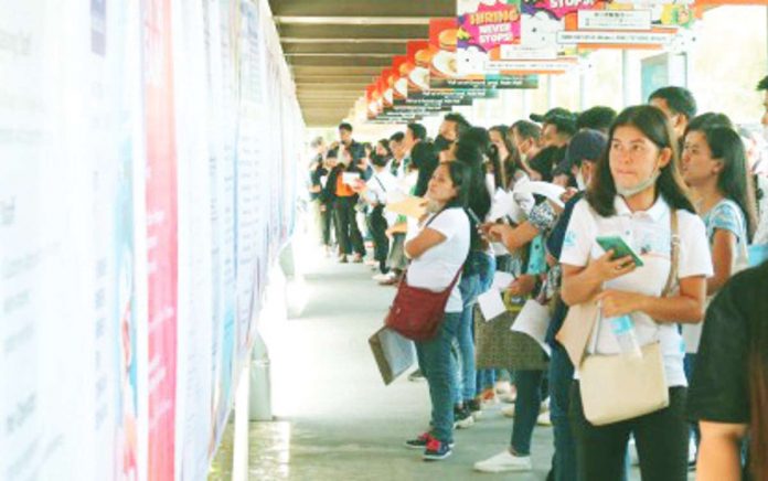 Jobseekers look at a list of vacancies during the Labor Day Job Fair in Davao City. The country's unemployment rate went down to 4.5 percent in September this year from 5 percent in the same month last year, the Philippine Statistics Authority reported on Wednesday, Nov. 8. PNA PHOTO BY ROBINSON NIÑAL JR.