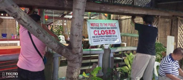 Personnel of the city government’s Task Force on Moral and Values Formation led the enforcement of closure order to five business establishments in Iloilo City for lack of business permits. PHOTO COURTESY OF NESTOR CANONG/TFMVF