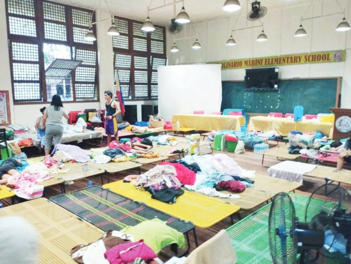 Fire victims in Barangay 29, Bacolod City seek temporary shelter at Apolinario Mabini Elementary School. MAE SINGUAY/PN