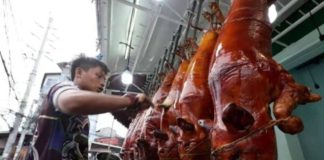 “Lechon” (roast pig) sellers in La Loma, Quezon City, expect sales to be brisk as Christmas Day nears. Doctors, however, warn revelers to watch their food and alcohol intake to avoid health problems related to the Christmas and New Year celebrations. Photo by GRIG. C. MONTEGRANDE / Philippine Daily Inquirer