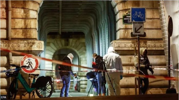 Forensics teams work at one of the scenes of a recent knife attack in Paris, France. EPA