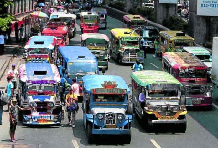 Traditional jeepneys ply along Aurora Boulevard in Cubao, Quezon City. The Land Transportation Franchising and Regulatory Board issued Memorandum Circular No. 2023-051, which serves as an official directive for consolidated transport entities to ply the roads under their existing provisional authority by Jan. 1, 2024. PHILIPPINE DAILY INQUIRER/ RICHARD A. REYES