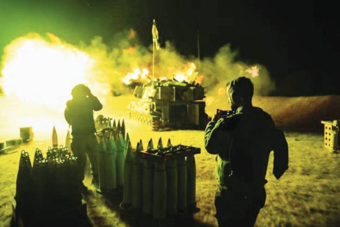 An Israeli Defense Force artillery unit fires towards Gaza Strip near the border in southern Israel. GETTY IMAGES