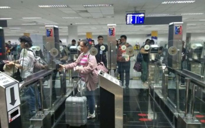 Arriving passengers utilize the electronic gates at the Ninoy Aquino International Airport Terminal 3 in Pasay City in this undated photo. From an average 130,000 daily passengers during the Christmas season in 2019, the figure is expected to reach up to 145,000 starting Dec. 22. PNA PHOTO BY CRISTINA ARAYATA